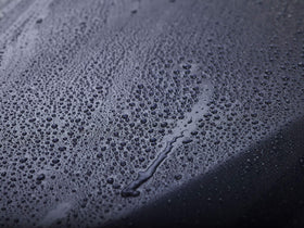 303 Products being sprayed on a wet car panel for fast touchless application