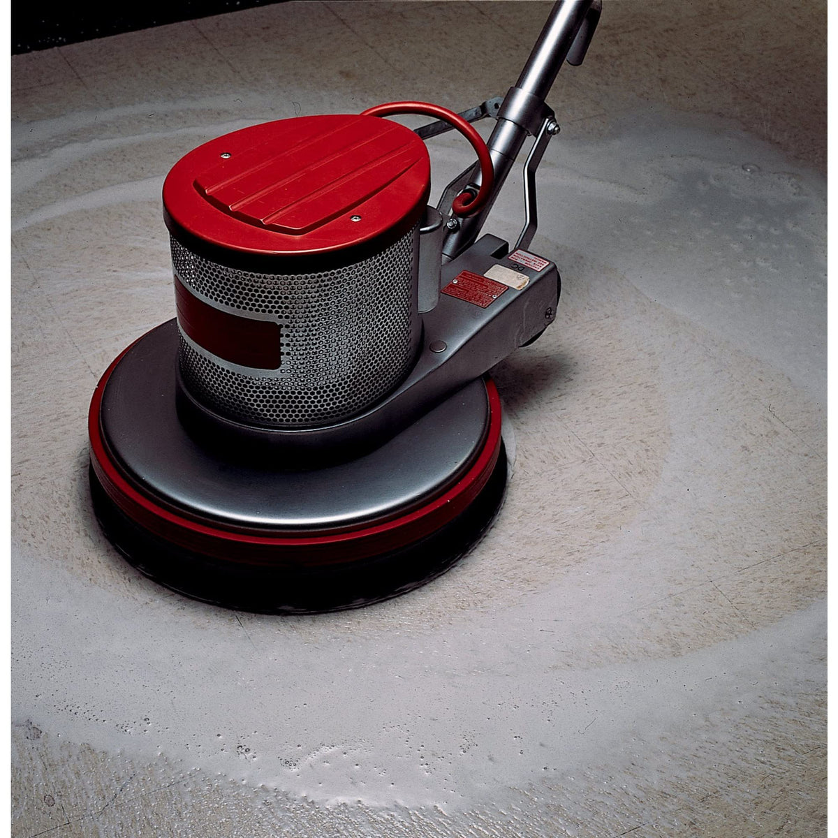 3M black stripper pad installed on rotary machine in use, removes old finish