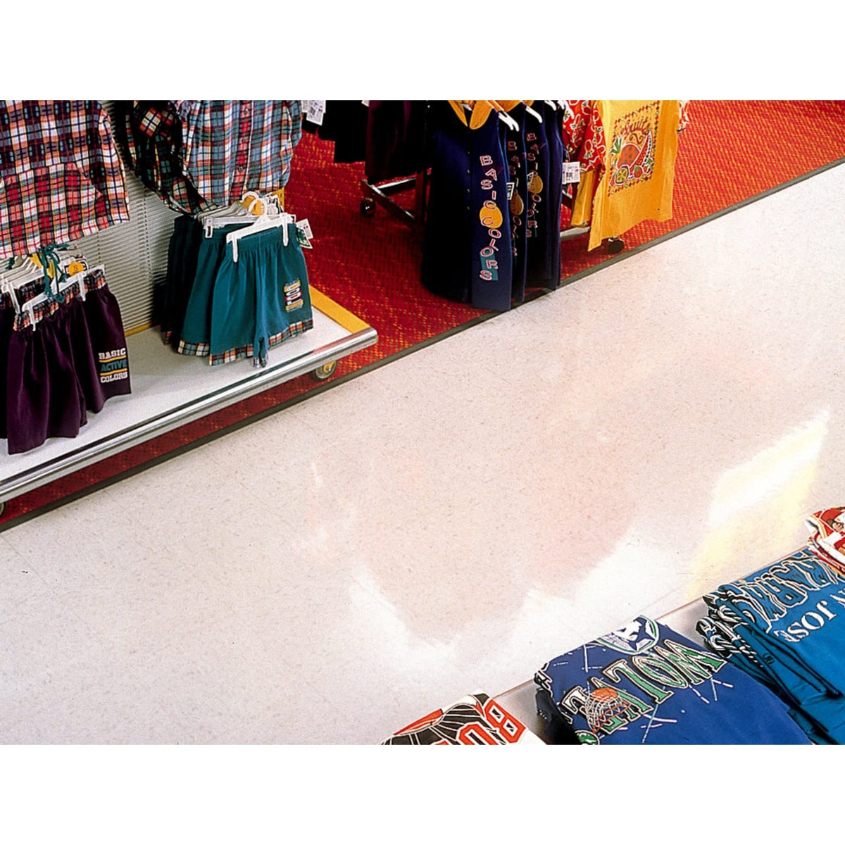 3M black stripper pad used in commercial facility setting, professional floor prep