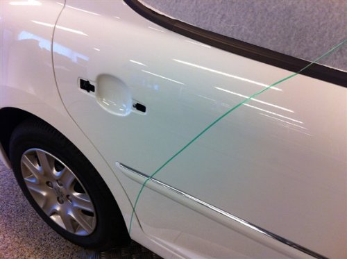 3M tape conforming around a car corner showing flexibility benefit
