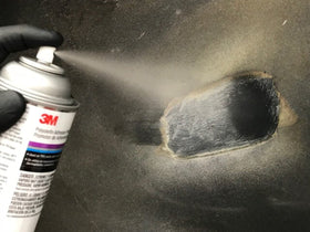 3M adhesion promoter being sprayed on TPO bumper showing even coverage for better adhesive bonding