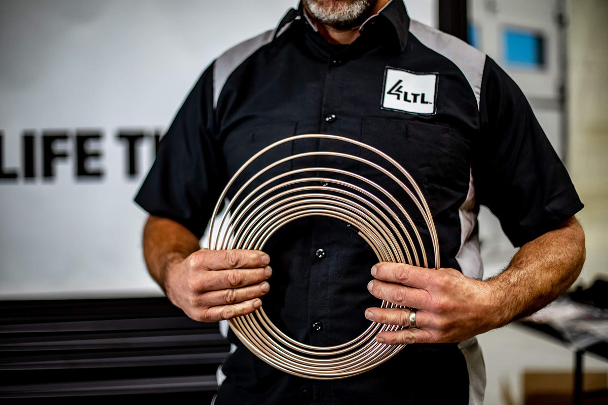 4LIFETIMELINES garage scene with technician using kit during classic car restoration for reliability