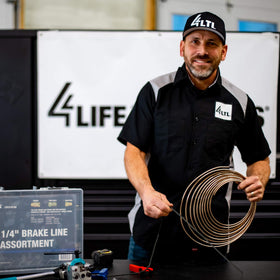 4LIFETIMELINES hanging on a plastic-coated wire loop for organized shop storage