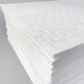 A A IN pad absorbing engine oil demonstrating quick uptake benefit