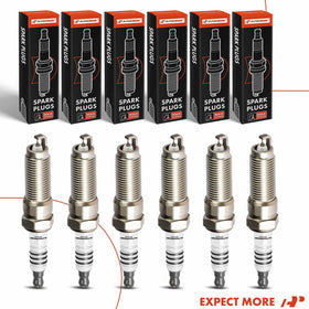 A-Premium spark plugs arranged in a garage setting suggesting DIY replacement ease