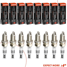 A-Premium spark plug next to ruler showing thread length and scale