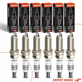 A-Premium spark plug next to ruler showing scale and accurate sizing