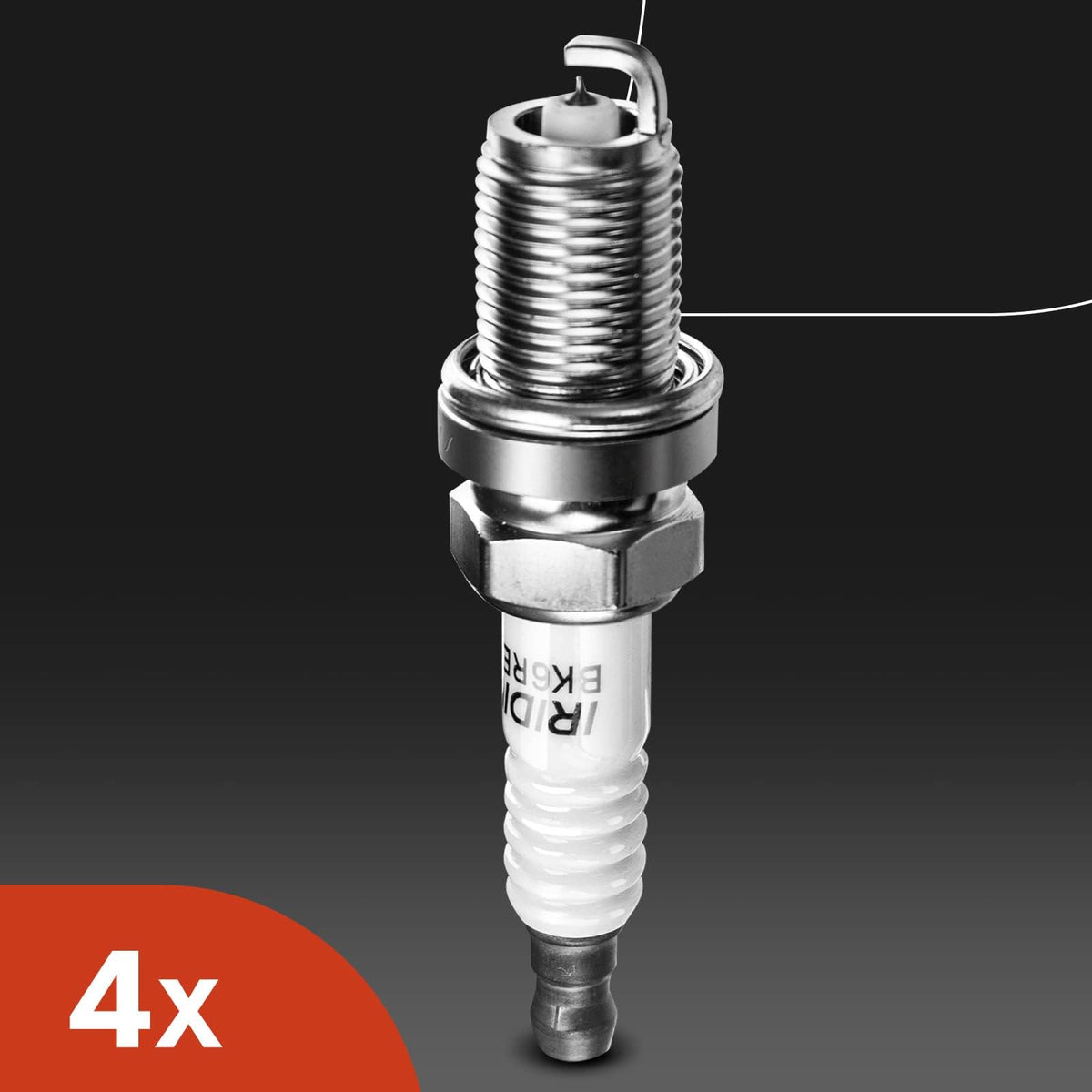 A-Premium kit beside a coin for scale to visualize coil and spark plug physical size