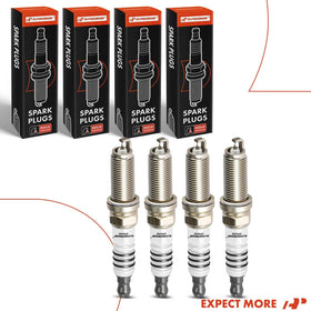 A-Premium plugs on a workbench during install showing hands-on fitting for DIY mechanics