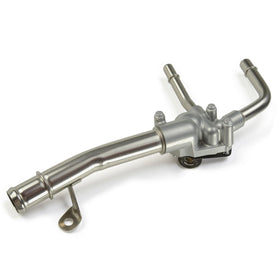 A-Premium thermostat housing installed in an engine bay illustrating direct-replacement benefit