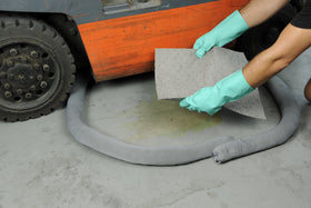 Aabaco socks in workshop protecting drains and reducing slip risk