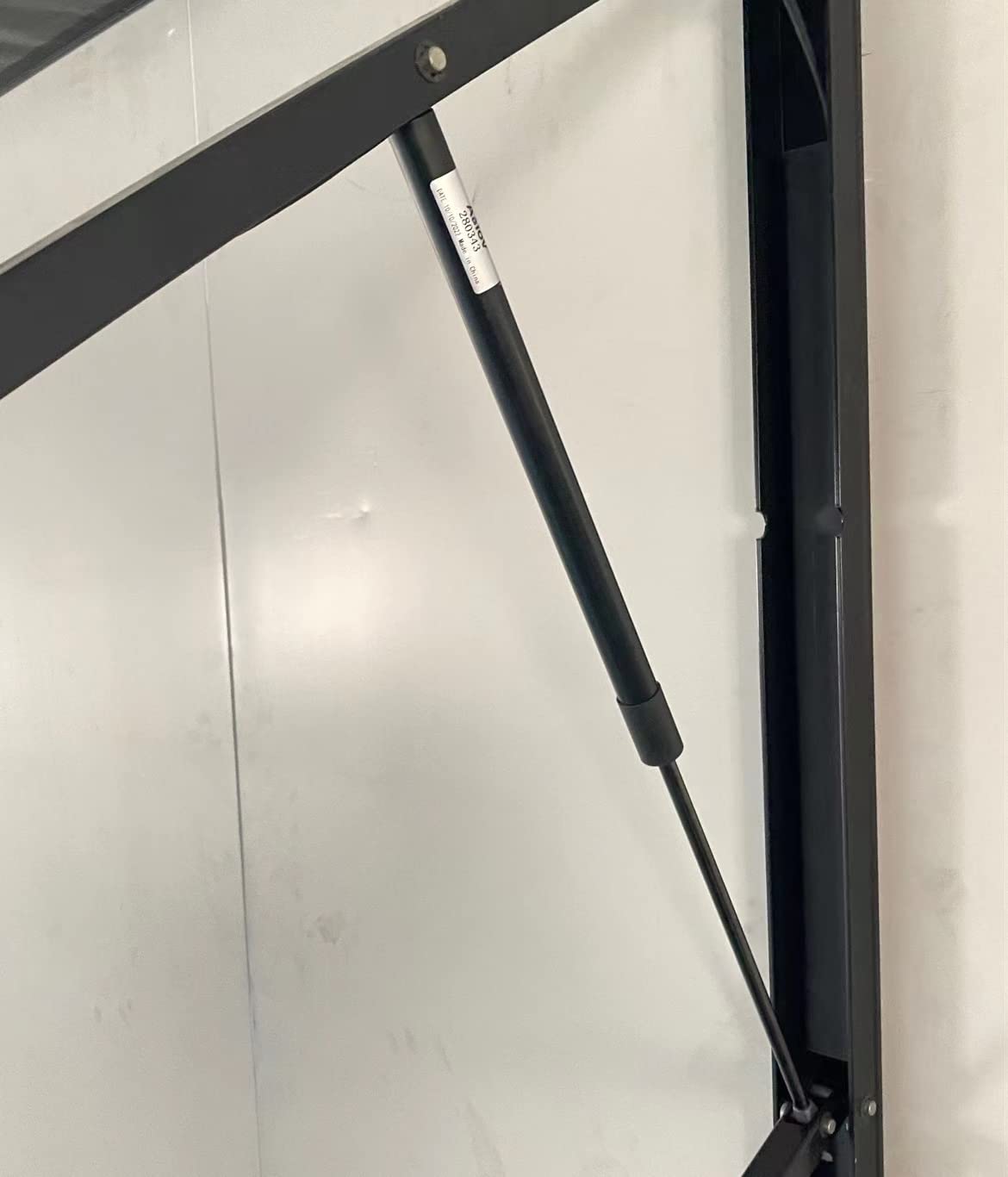 Aaiov next to ruler indicating 24.35" extended length for correct sizing and fit