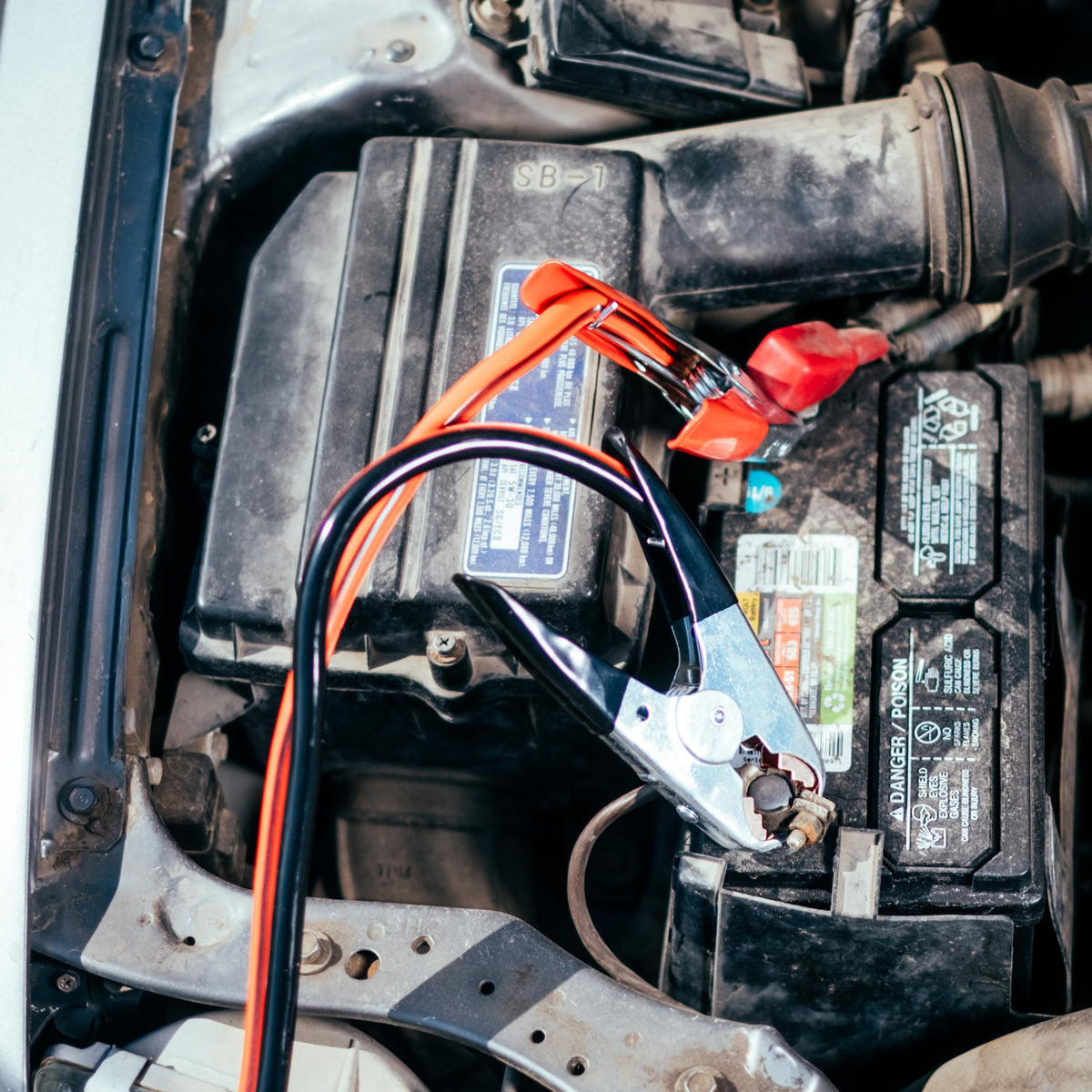 ABN cables used beside a roadside scene showing reliable emergency assistance benefit