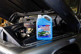 Windshield wipers clearing bug residue with ABRO fluid for improved visibility