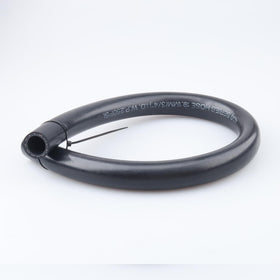 AC PERFORMANCE close-up of hose end and textile reinforced cover, highlights durable build