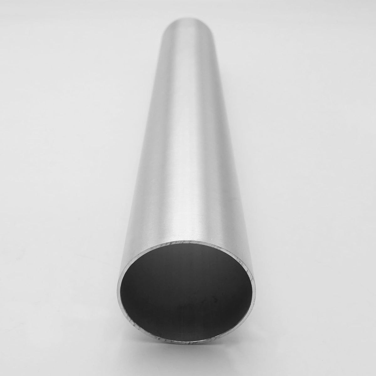 AC PERFORMANCE pipe beside ruler for scale showing exact 11.8-inch length benefit