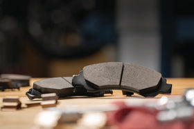 ACDelco close-up of ceramic pad surface highlighting low-dust material and long wear benefit