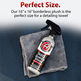 Adam's towel laid next to ruler to show 16x16 size and maneuverability benefit