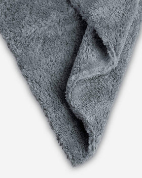 Adam's Borderless grey towel in hand demonstrates 16x16 size and handling ease