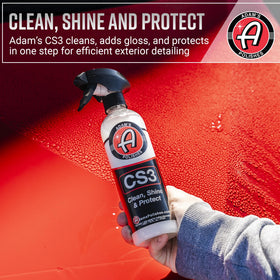 Adam's Polishes glass cleaner spraying streak-free finish for improved visibility