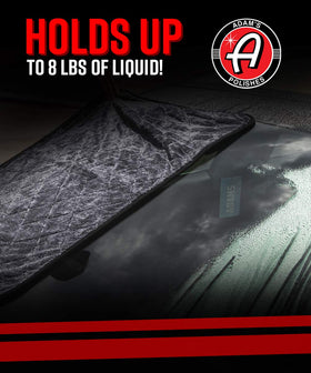 Adam's Polishes towel being used on a car hood in sunlight showing streak-free drying benefit