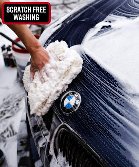Adam's Polishes pad being rinsed to remove grit and maintain safe washing