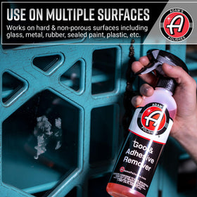 Adam's Polishes bottle in hand for scale and user-friendly application