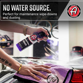 Adam's Polishes spray mist applied to car door panel demonstrating easy use