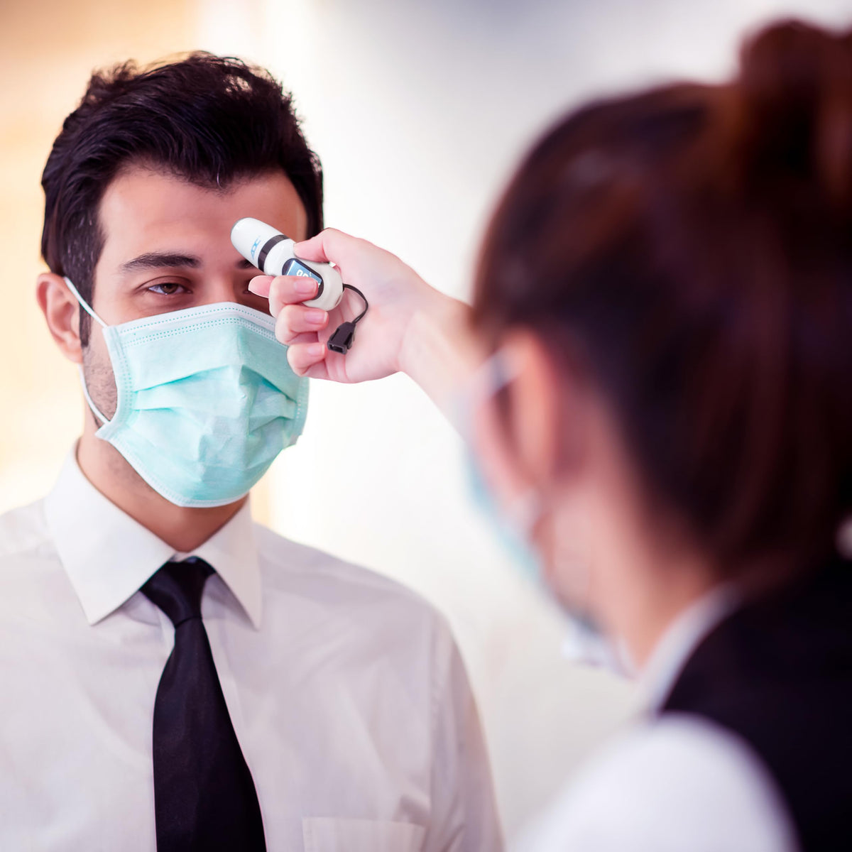 ADC Adtemp‑Mini 432 in clinical use scenario demonstrating quick screening workflow