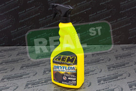 AEM cleaner in use rinsing a synthetic Dryflow filter, restores airflow benefit