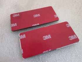 Aimoll close-up of ABS emblem texture and 3M tape backing showing durable, weatherproof benefit
