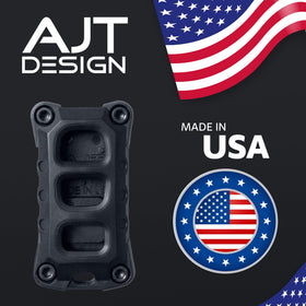 AJT DESIGN next to a car key for size comparison showing compact, travel-ready convenience