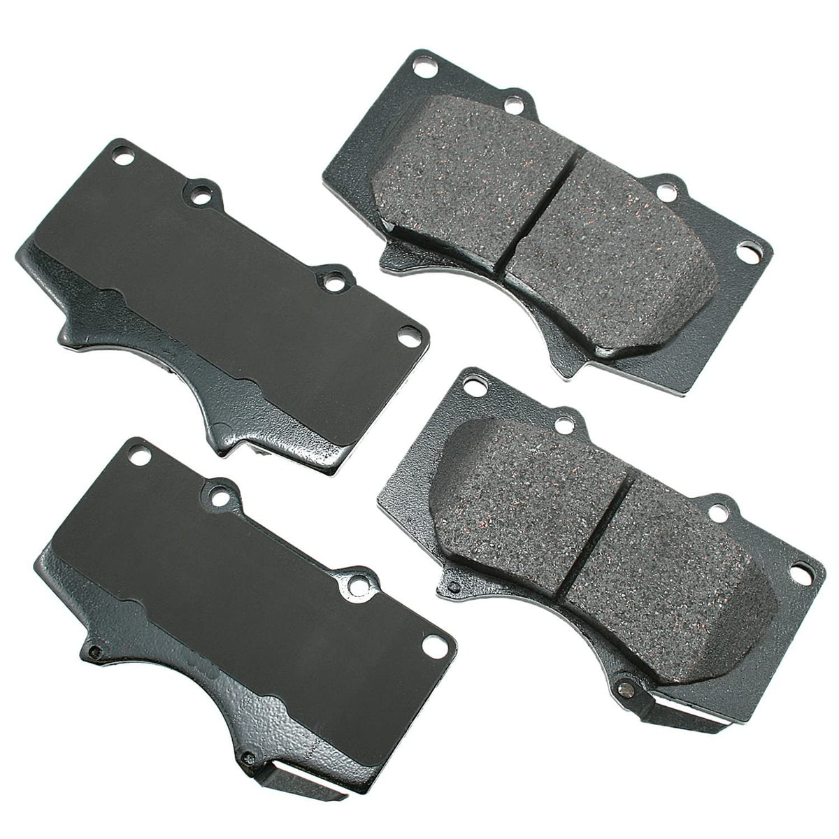 Akebono front brake pad set showing pads and backing plate for quiet braking