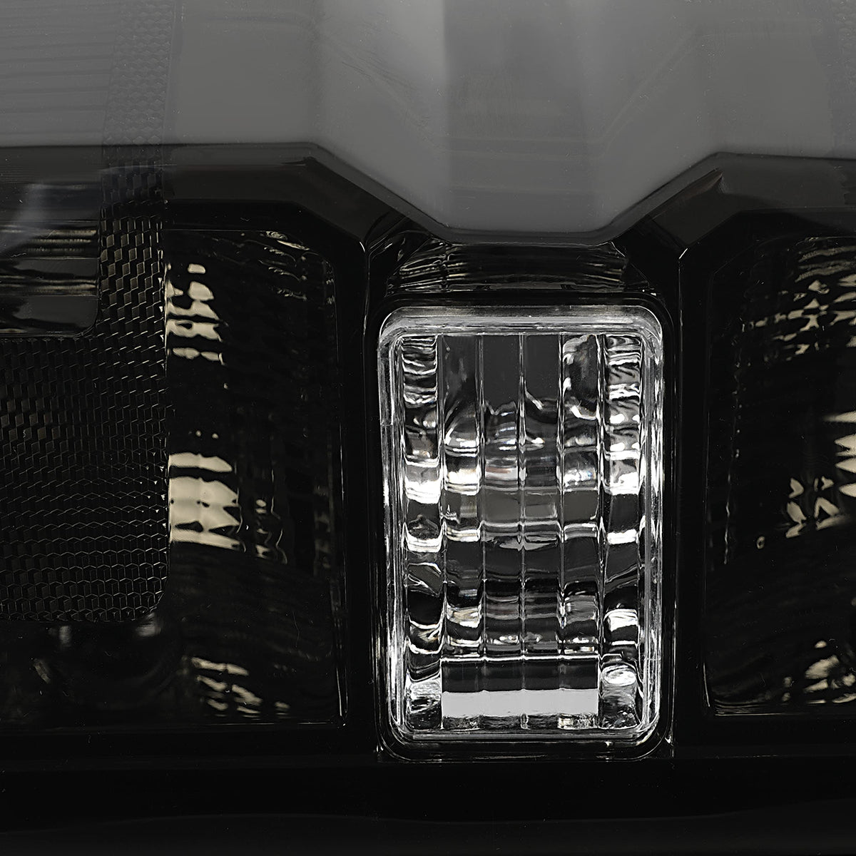 ALMULOO lens and housing texture close-up showing impact resistance benefit