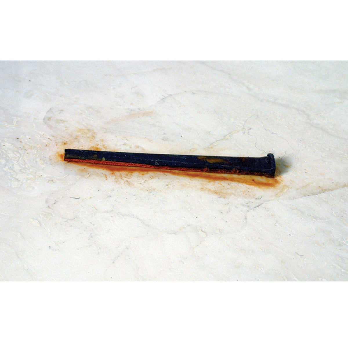 Alpha Professional Tools gel applied to a stone surface for precise rust treatment