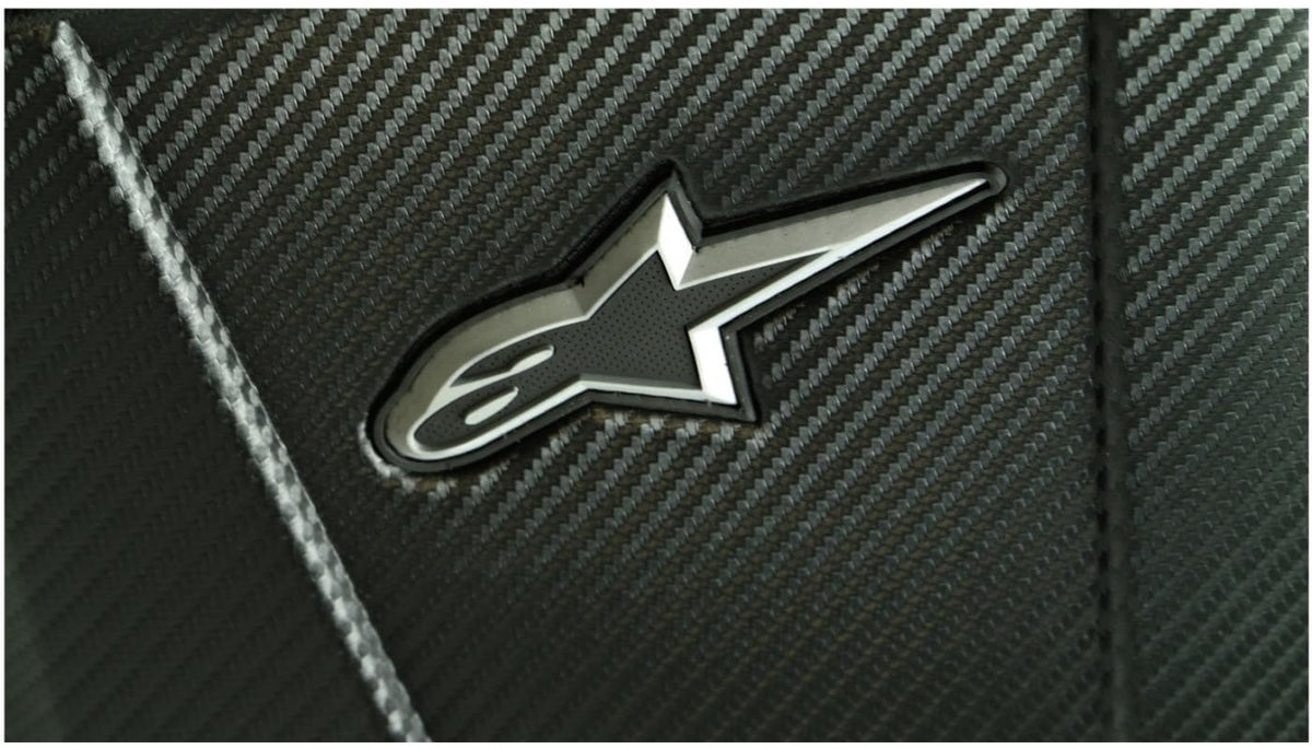 Alpinestars backpack worn by cyclist on road improving stability and visibility