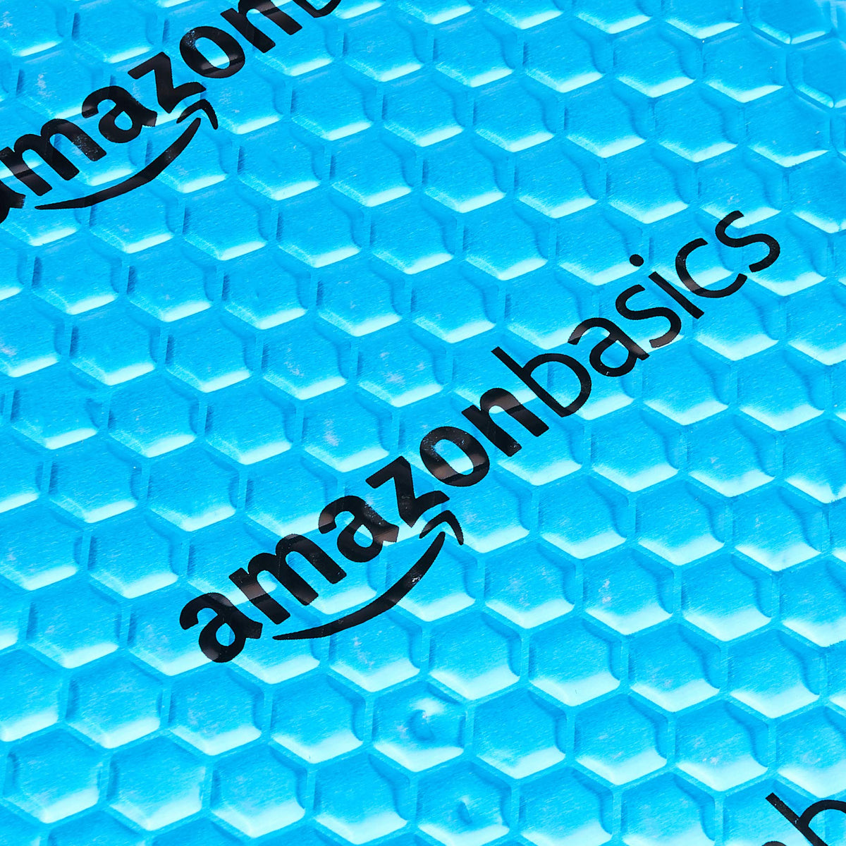 Amazon Basics panel next to ruler showing 18x32 inch size for clear coverage planning