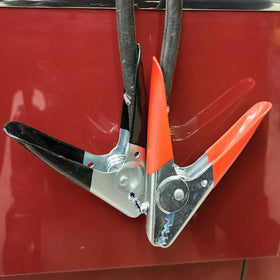 Ampper clamps in use on battery post demonstrating firm connection and stability