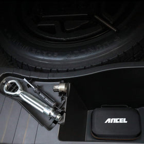 ANCEL case next to a hand and ruler showing compact 7.9 x 5.5 x 2.8 inch size
