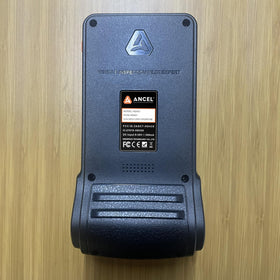 ANCEL HD431 next to a handheld tool for scale, compact portability benefit