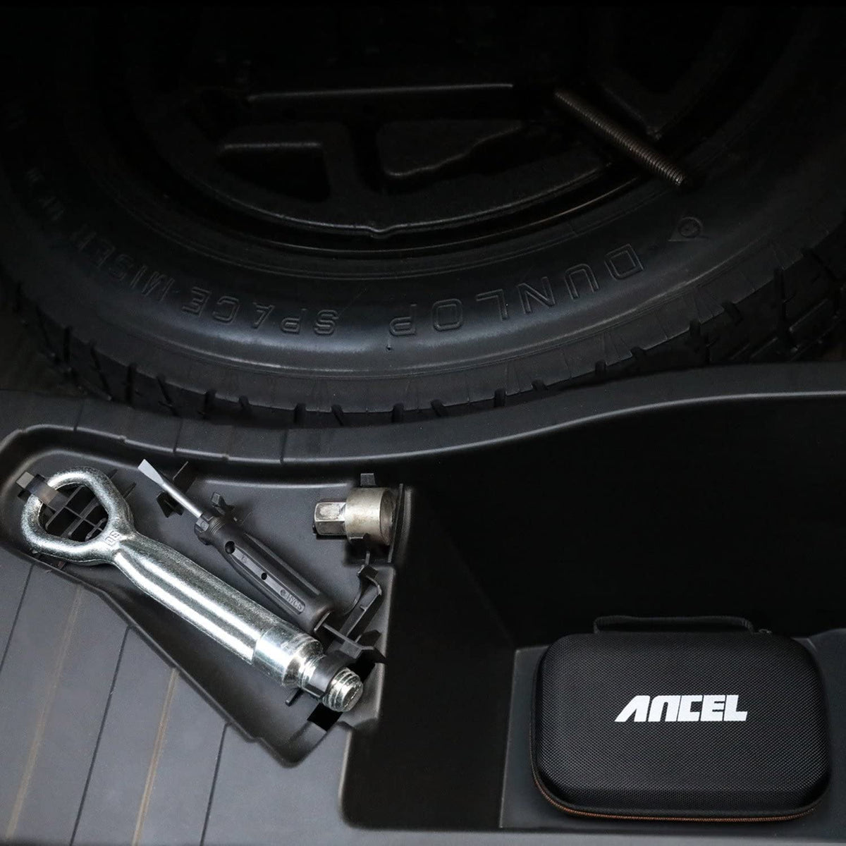 ANCEL case in glovebox showing compact fit and space-saving storage