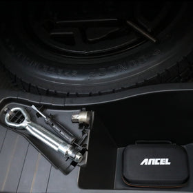ANCEL case in glovebox showing compact fit and space-saving storage