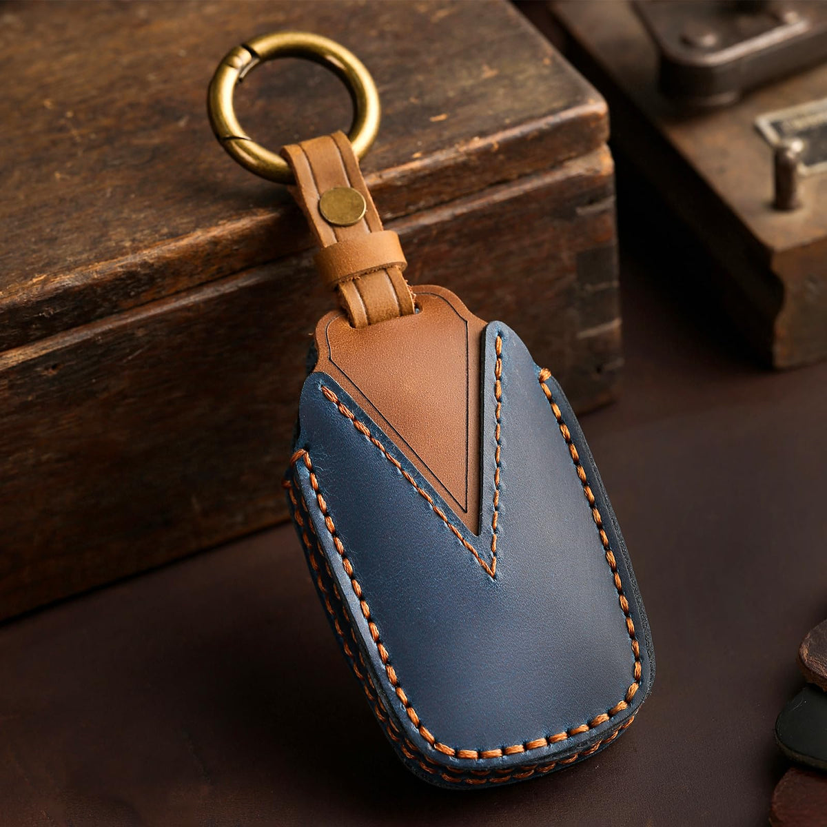 Aoocar key fob cover in hand illustrating compact scale and improved grip