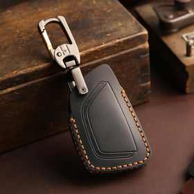 Aoocar key on keyring beside car interior showing style match and convenience benefit