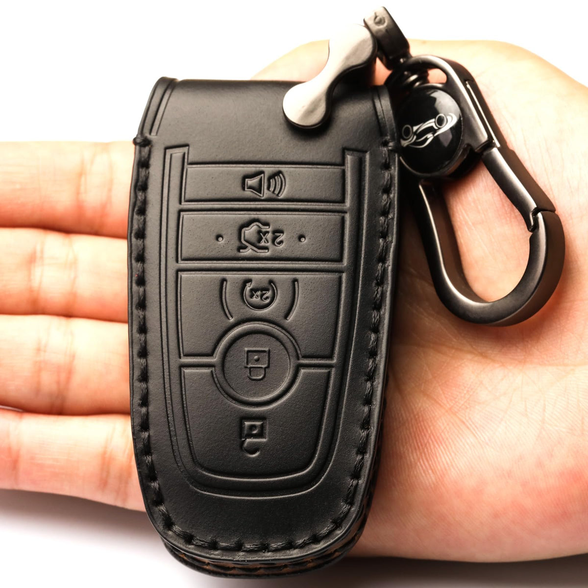 APEKUU key shell with attached leather keychain held in hand for easy carry