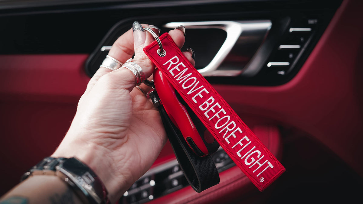 Apex Imports attached to luggage demonstrating visibility and quick-find benefit