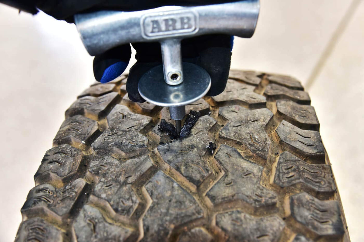 ARB Speedy Seal II next to a ruler for scale to show compact travel-ready size
