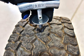 ARB Speedy Seal II next to a ruler for scale to show compact travel-ready size
