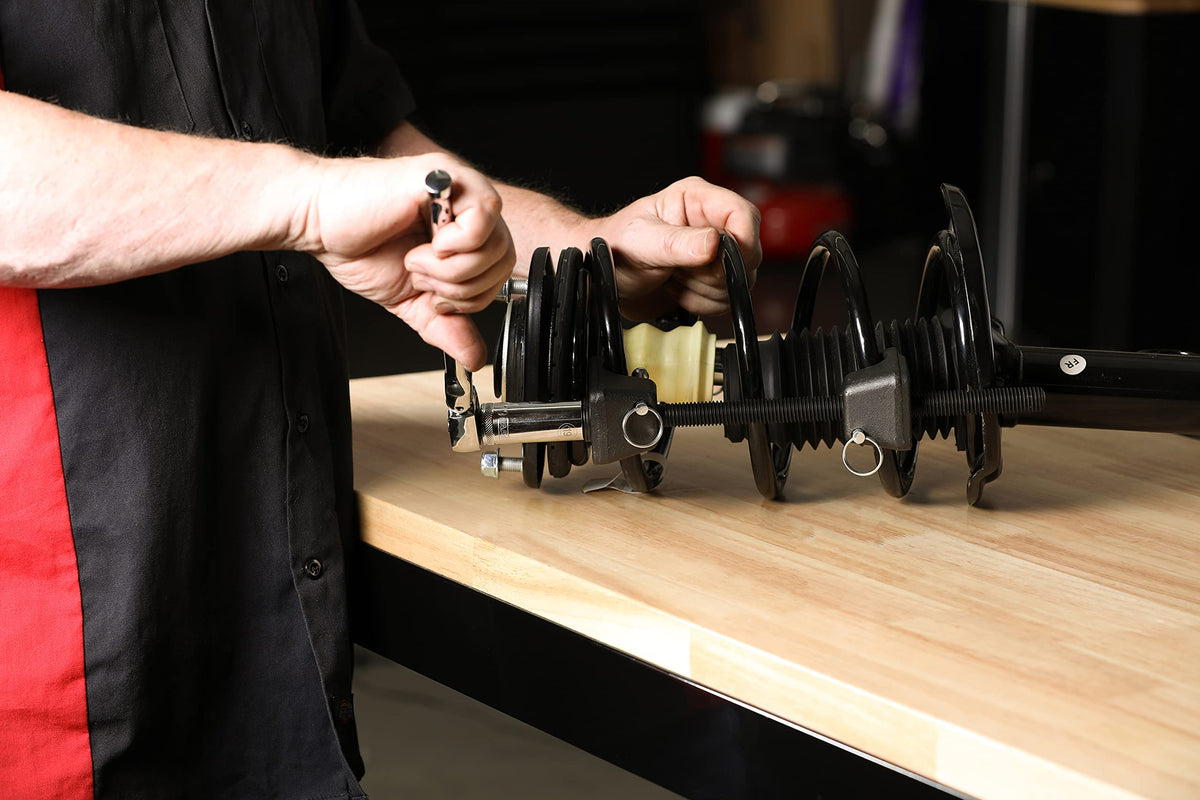 ARES compressing spring off vehicle enabling controlled workshop repairs
