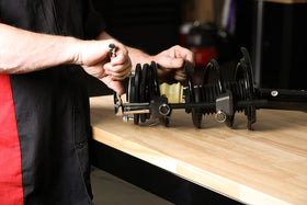 ARES compressing spring off vehicle enabling controlled workshop repairs